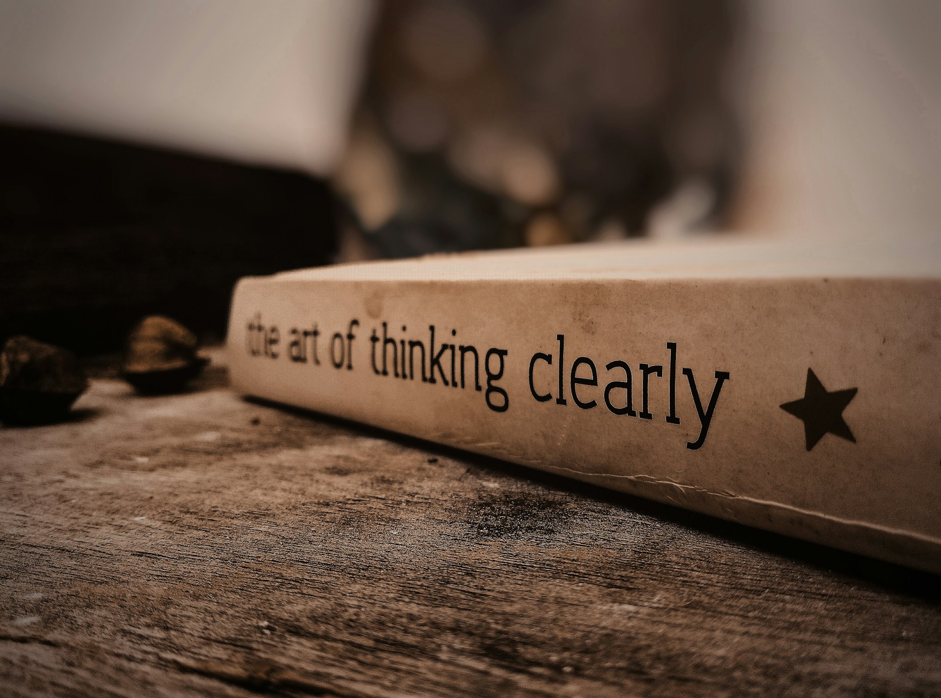 a white box with black text on a wooden surface